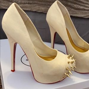 Tan spiked heels